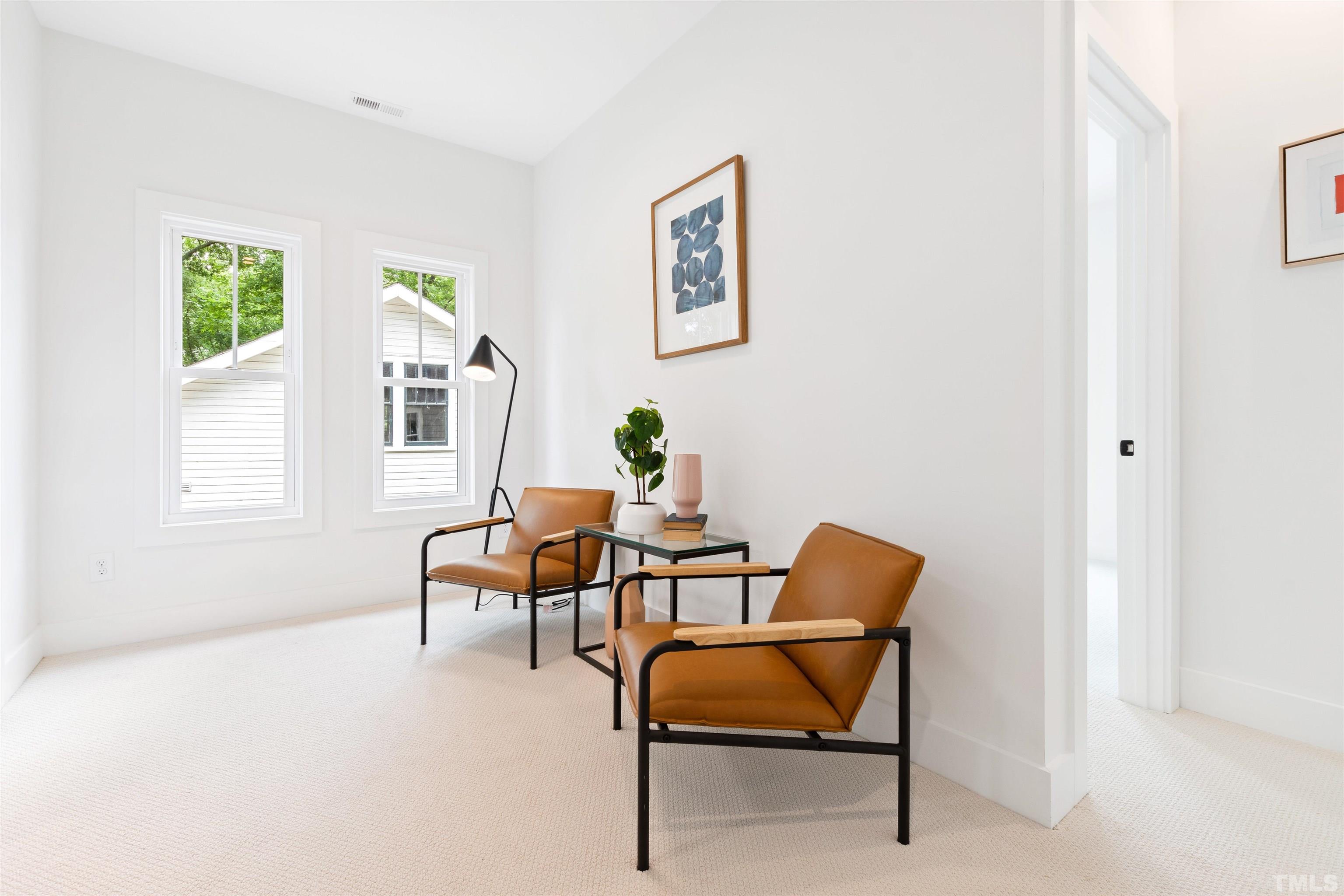 704 Colonial Street Durham, NC 27701 - Photo 23 of 42 a living room with furniture and a window