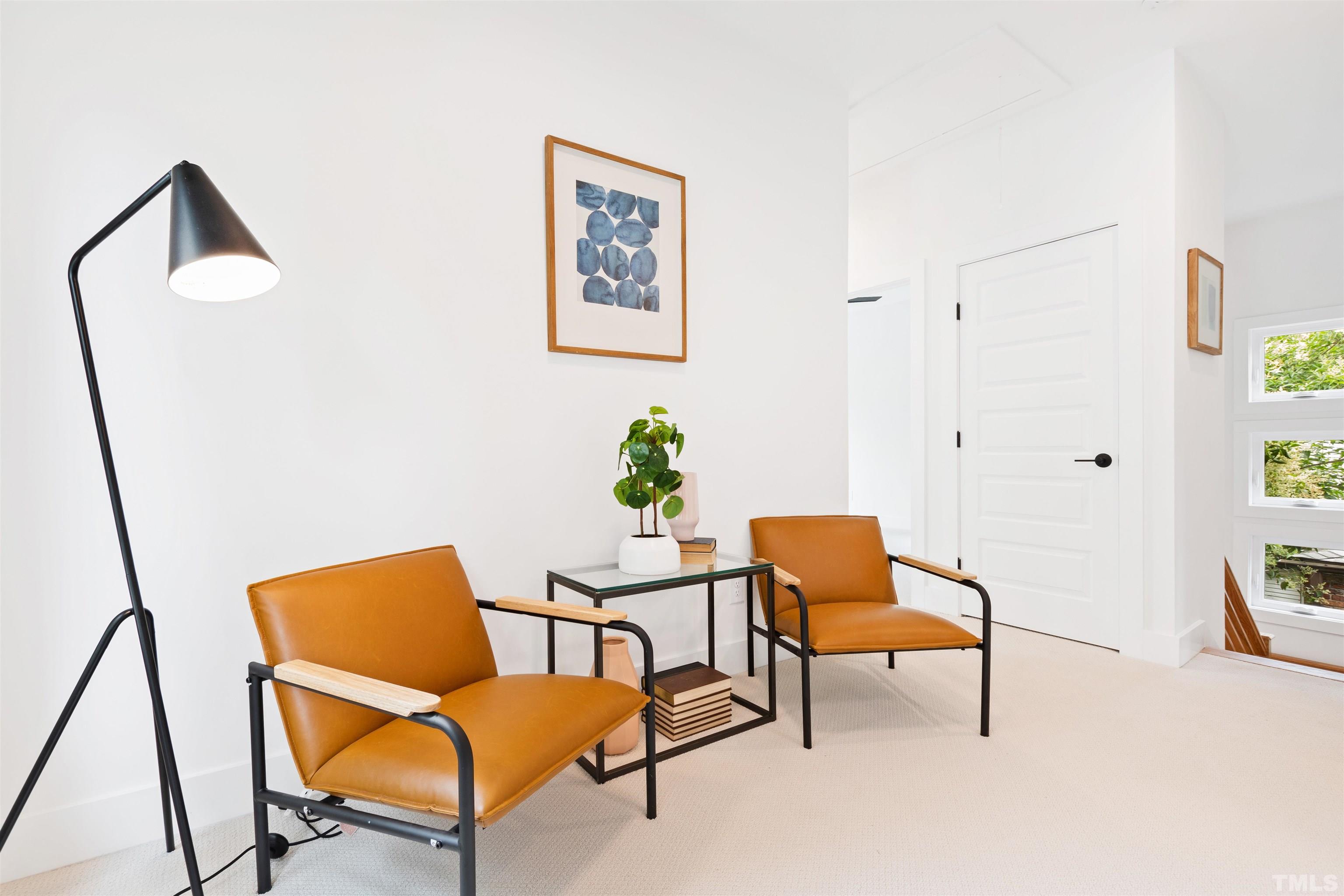 704 Colonial Street Durham, NC 27701 - Photo 29 of 42 a chair and a table in a room