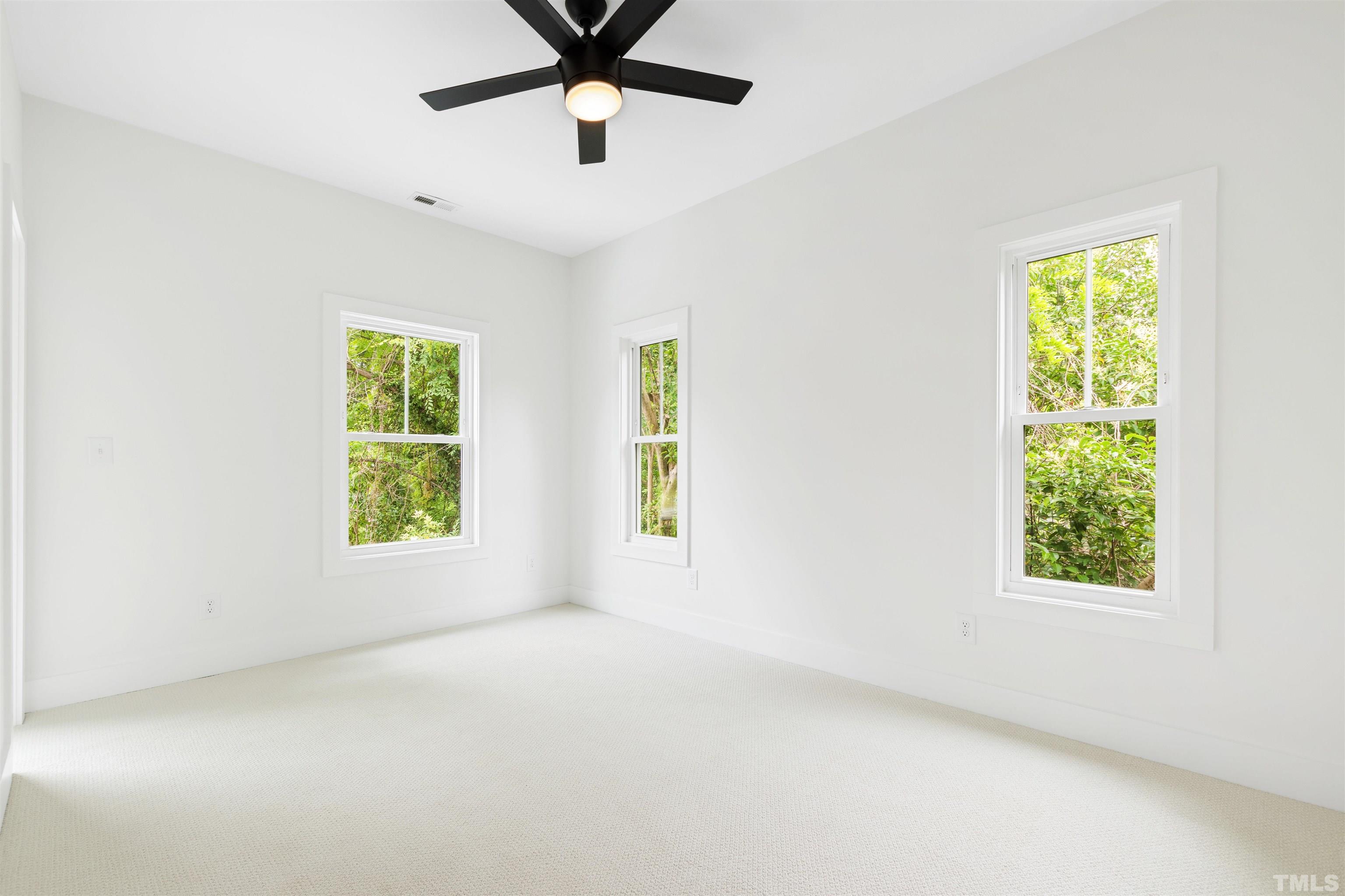 704 Colonial Street Durham, NC 27701 - Photo 32 of 42 an empty room with a window