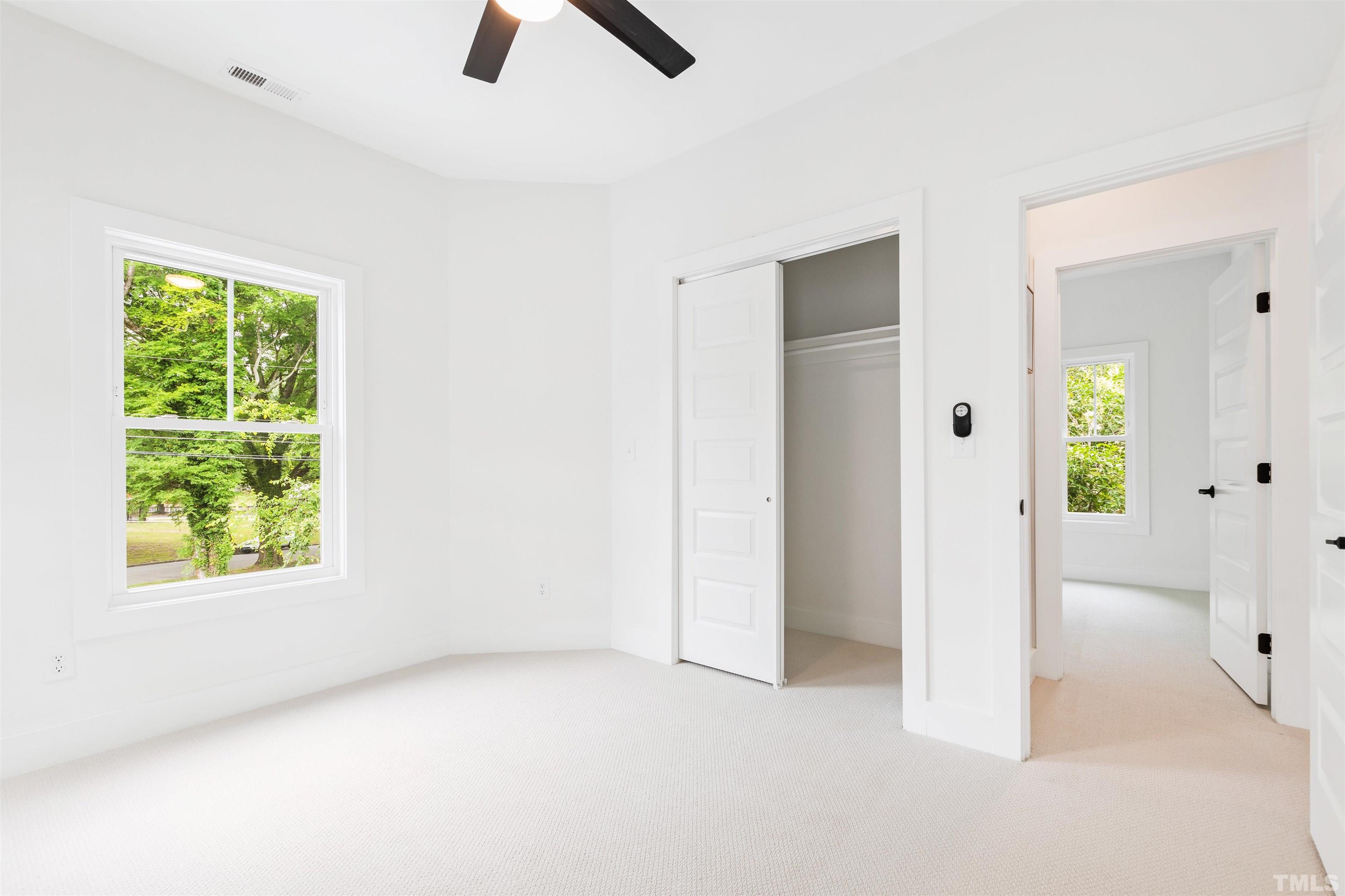 704 Colonial Street Durham, NC 27701 - Photo 37 of 42 an empty room with windows and closet
