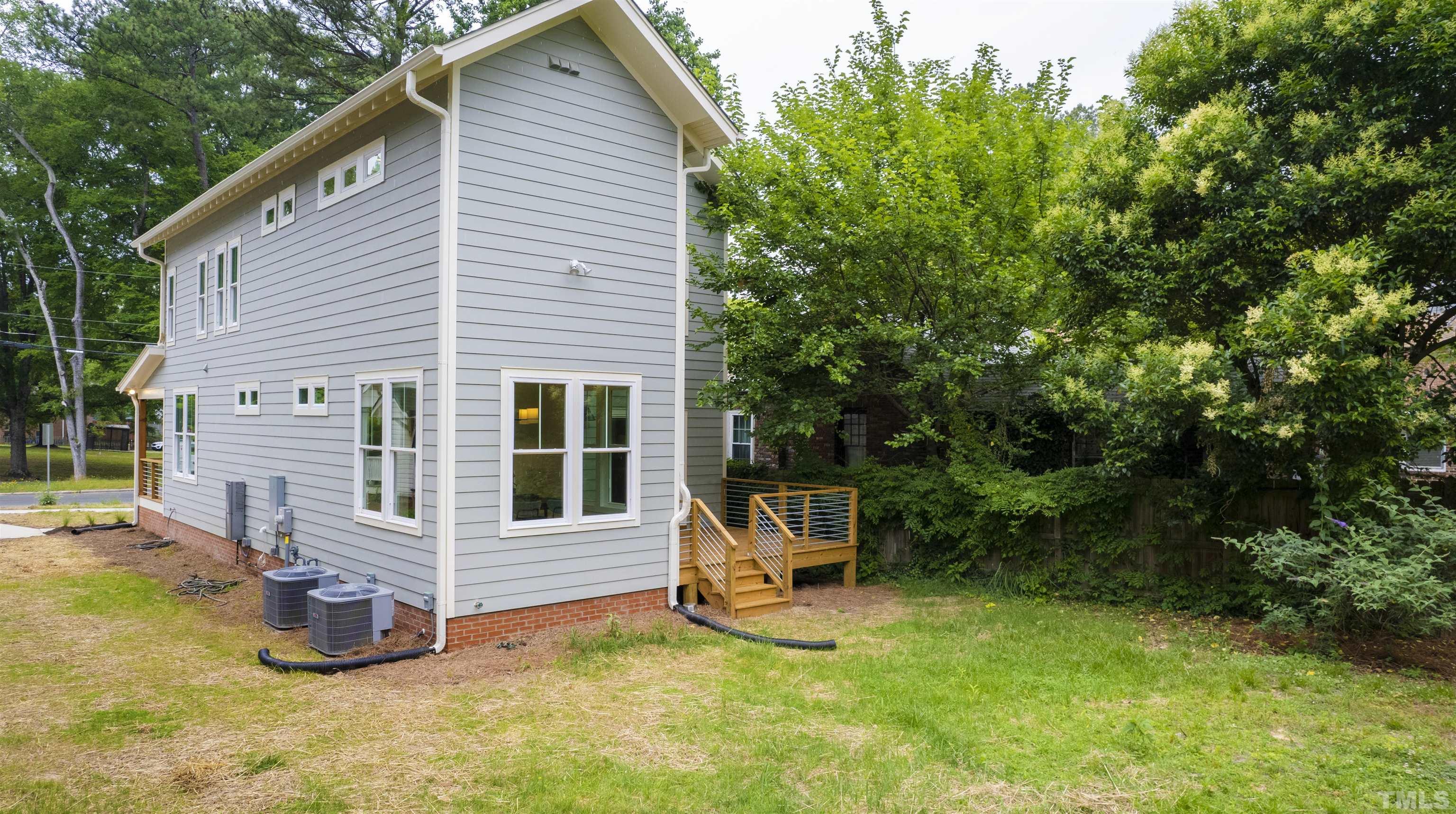 704 Colonial Street Durham, NC 27701 - Photo 39 of 42 a view of a small house with backyard