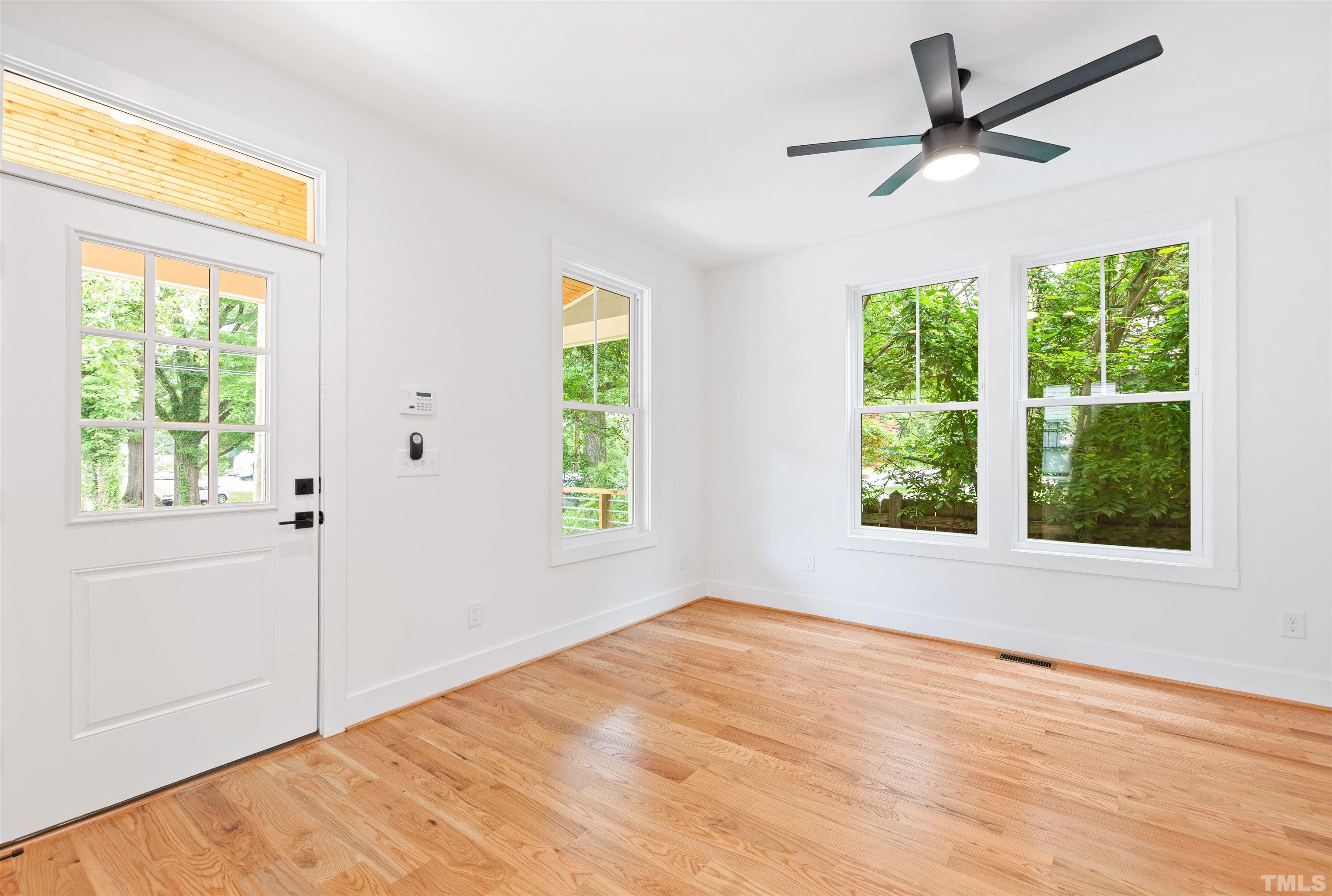 704 Colonial Street Durham, NC 27701 - Photo 4 of 42 a view of an empty room with a window