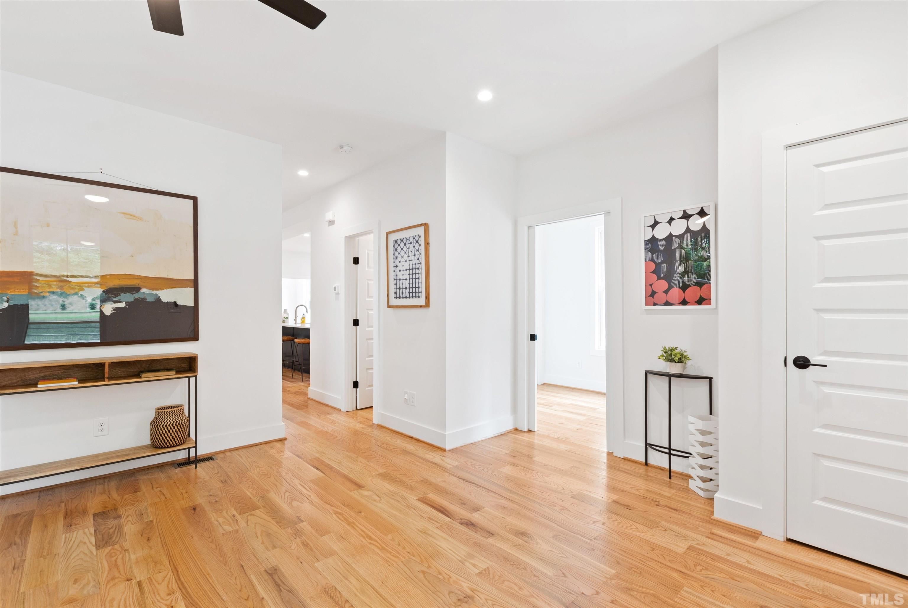 704 Colonial Street Durham, NC 27701 - Photo 5 of 42 a view of a hallway with wooden floor and windows