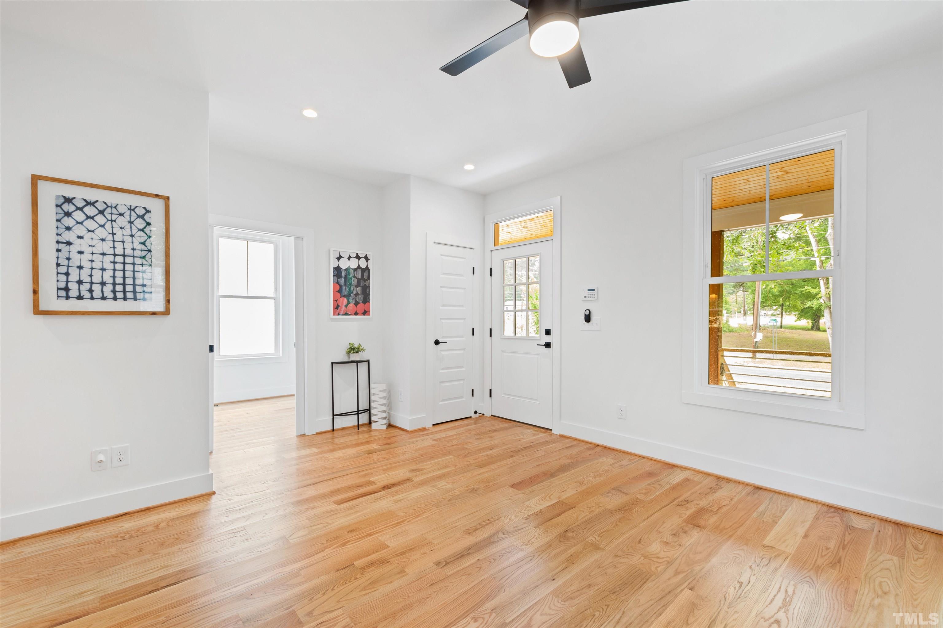 704 Colonial Street Durham, NC 27701 - Photo 6 of 42 a room with window and a ceiling fan