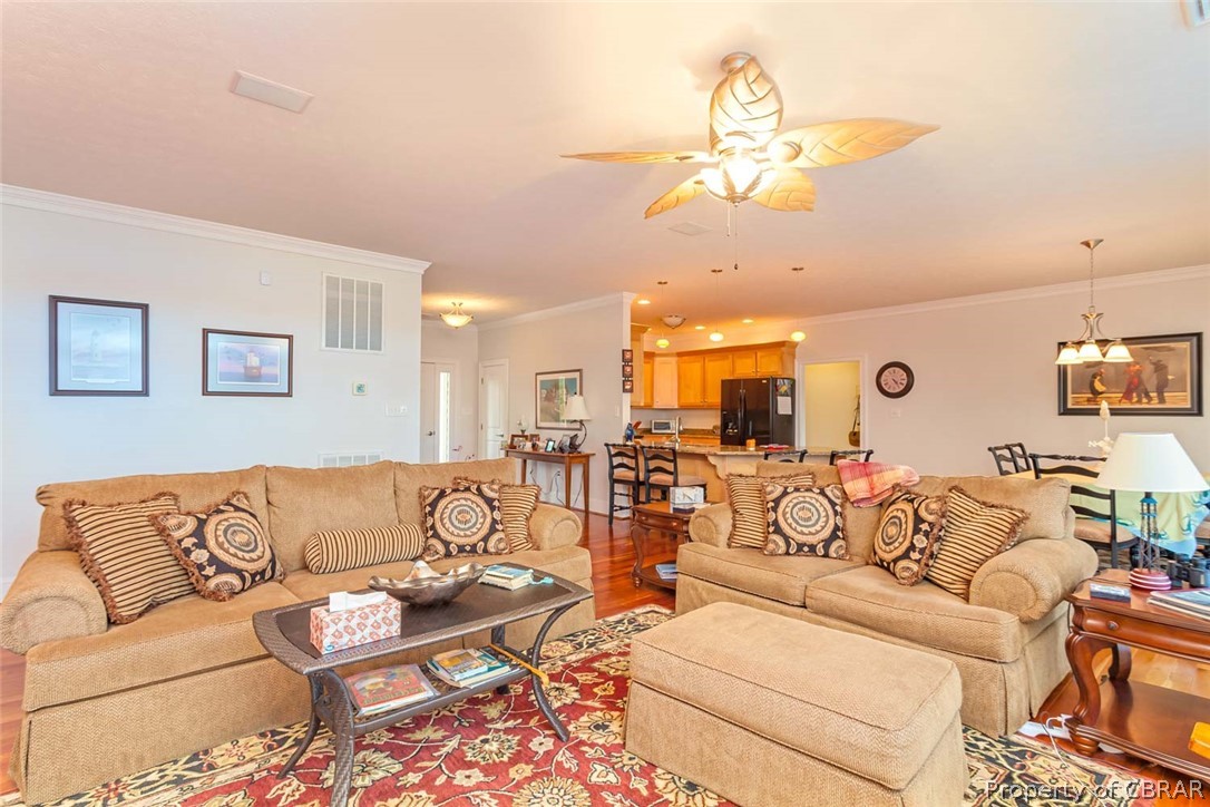 102 Ferry Road Hartfield, VA 23071 - Photo 28 of 42 View of Living Room to Kitchen & Dining