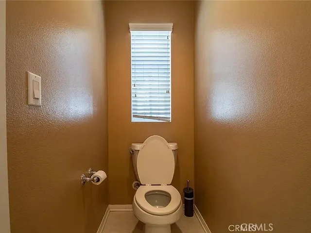 a bathroom with a toilet and a bathtub
