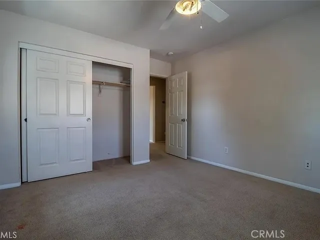 a view of a chair and table on the garden