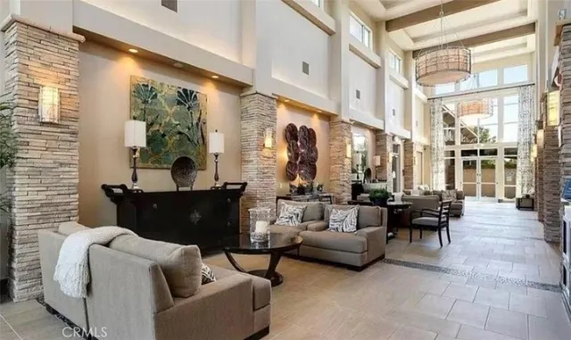 a view of a patio with table and chairs with wooden fence and plants