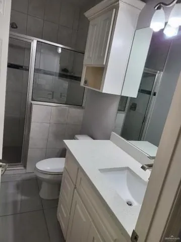 a bathroom with a sink and toilet
