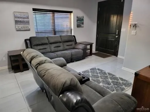 a living room with furniture and a window