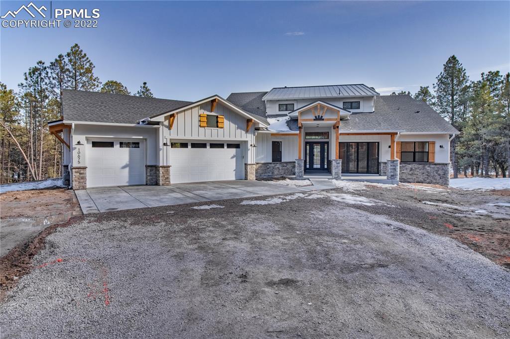 10675 Hardy Road Colorado Springs, CO 80908 - Photo 1 of 45 a front view of a house with a yard