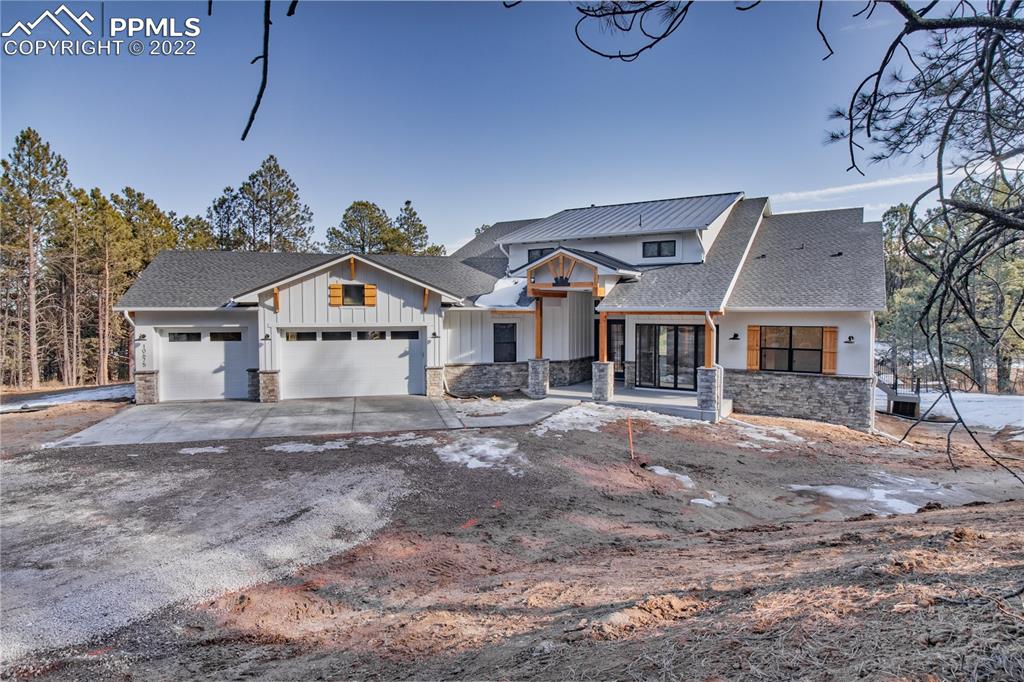 10675 Hardy Road Colorado Springs, CO 80908 - Photo 2 of 45 a front view of a house with garden