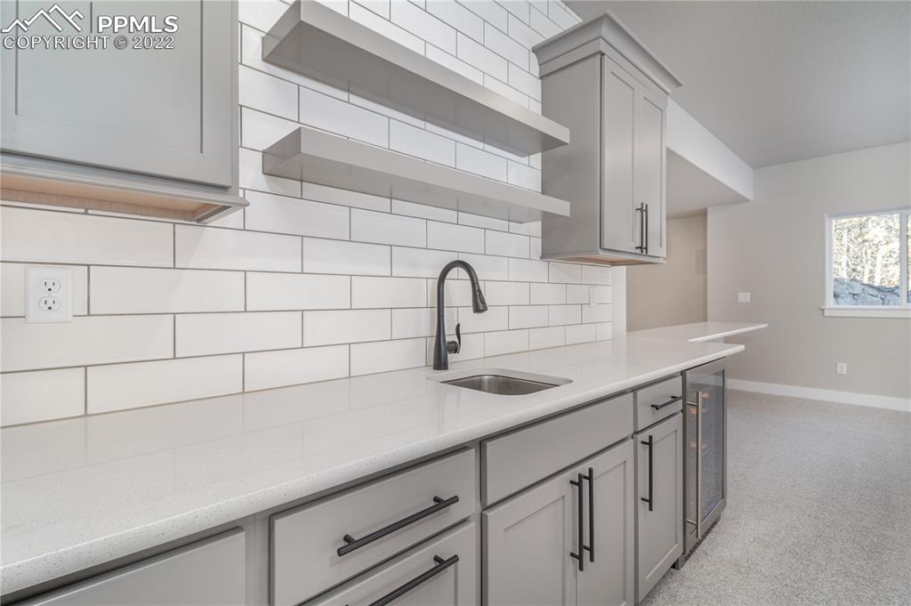 10675 Hardy Road Colorado Springs, CO 80908 - Photo 23 of 45 a sink with white cabinets