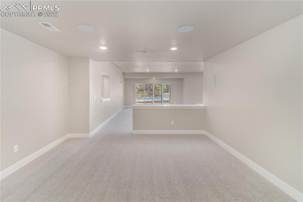 10675 Hardy Road Colorado Springs, CO 80908 - Photo 25 of 45 a view of an empty room with a window