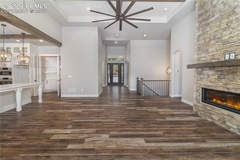 10675 Hardy Road Colorado Springs, CO 80908 - Photo 6 of 45 a view of a livingroom with an empty space and a fireplace