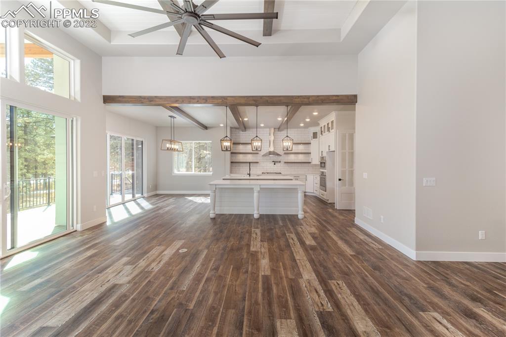 10675 Hardy Road Colorado Springs, CO 80908 - Photo 9 of 45 a view of a living room with wooden floor