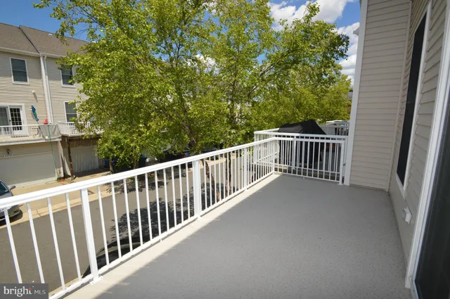 a view of balcony with furniture