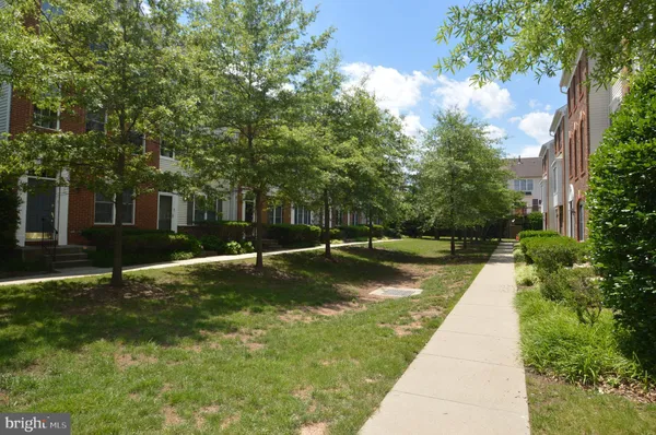 a view of a swimming pool with a yard