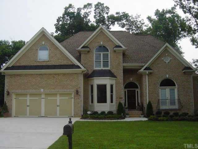 2021 Gresham Lake Road Raleigh, NC 27615 - Photo 1 of 1 a front view of a house with a yard and trees
