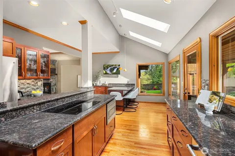 a very nice looking kitchen with a large window