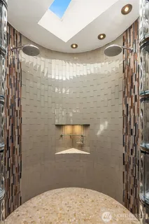 a bathroom with a sink and shower