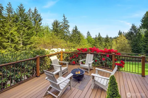 a view of balcony with wooden floor and outdoor seating