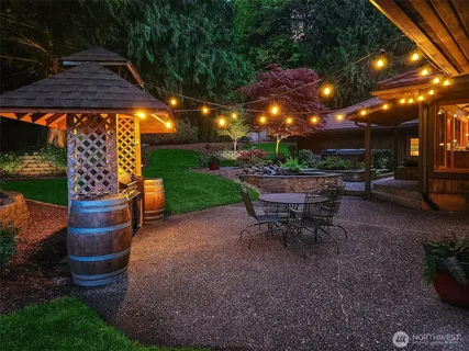 a view of a backyard with sitting area and furniture