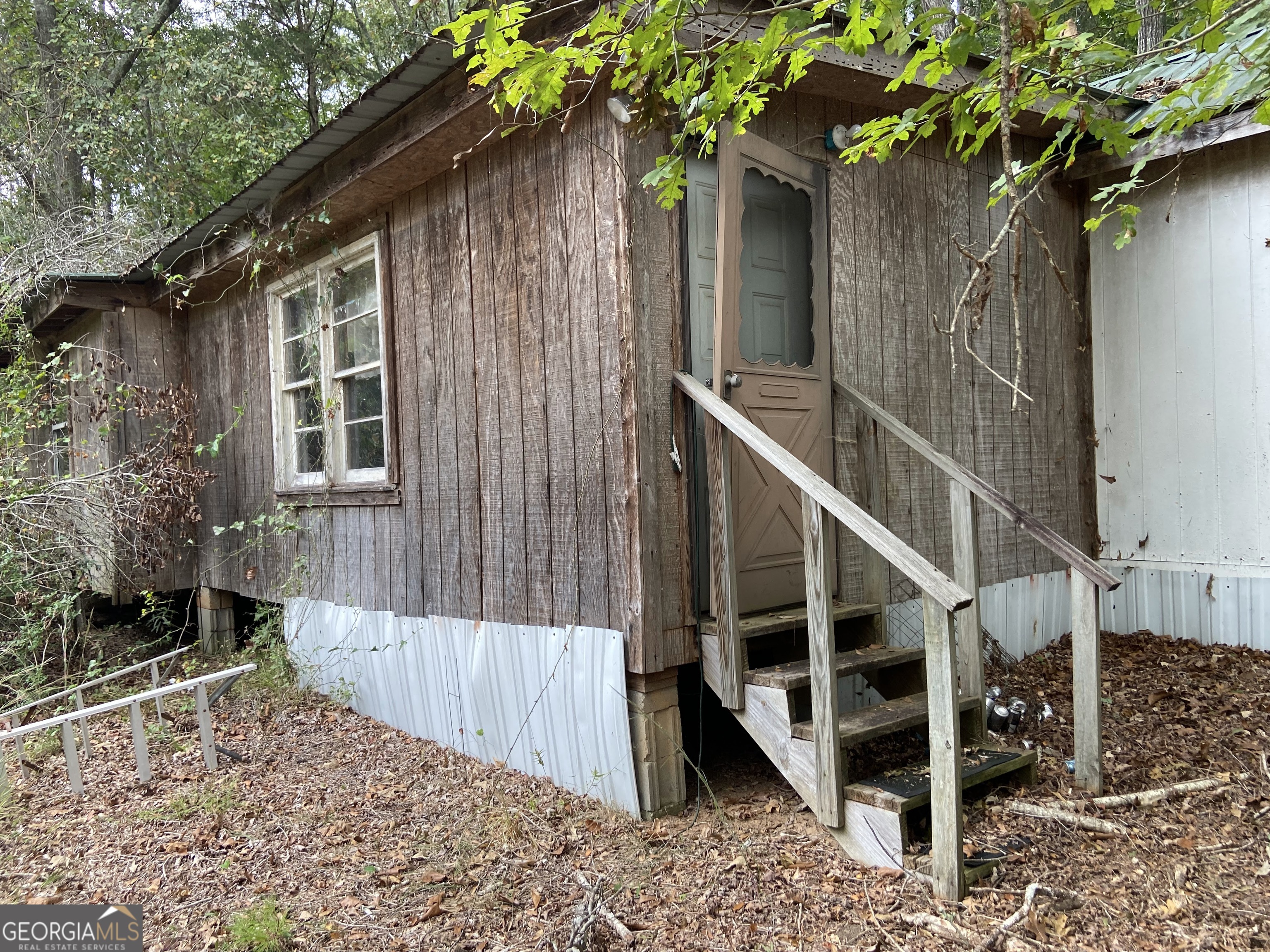 2321 Double Branches Road Elberton, GA 30635 - Photo 1 of 1 a view of wooden house with a tree
