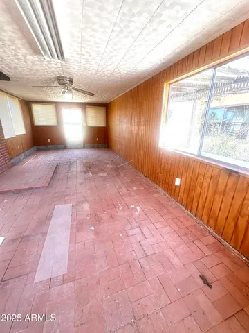 a view of a room with wooden walls