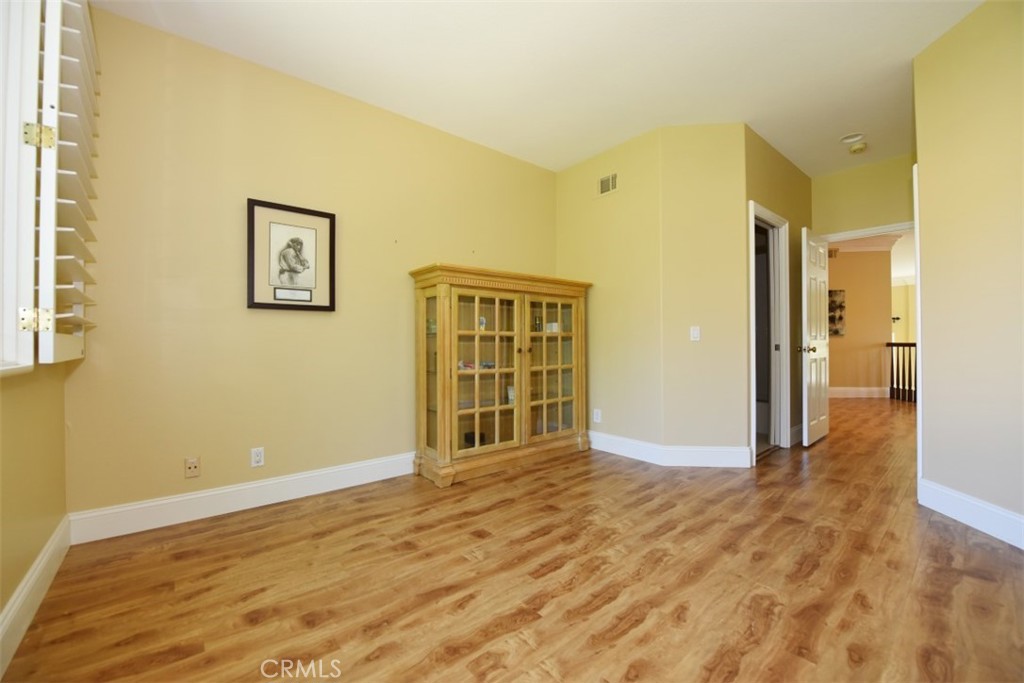 12 Brigadier Irvine, CA 92603 - Photo 43 of 50 a view of an empty room with wooden floor and a window