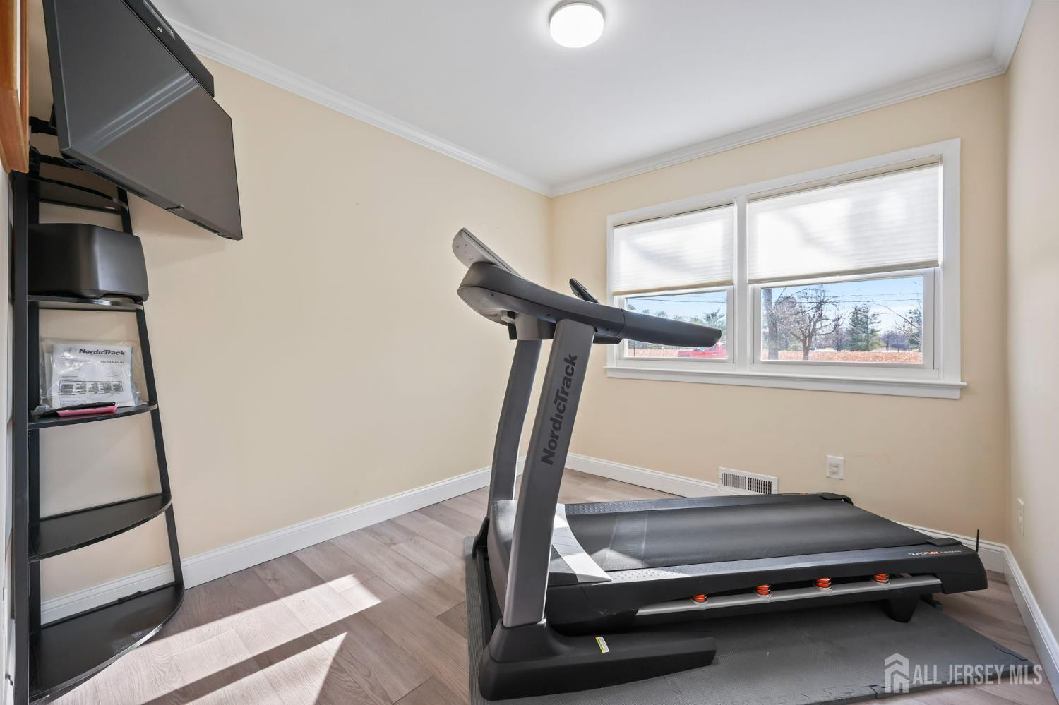 568 Village Road West Windsor, NJ 08550 - Photo 15 of 43 a room with gym equipment and a window
