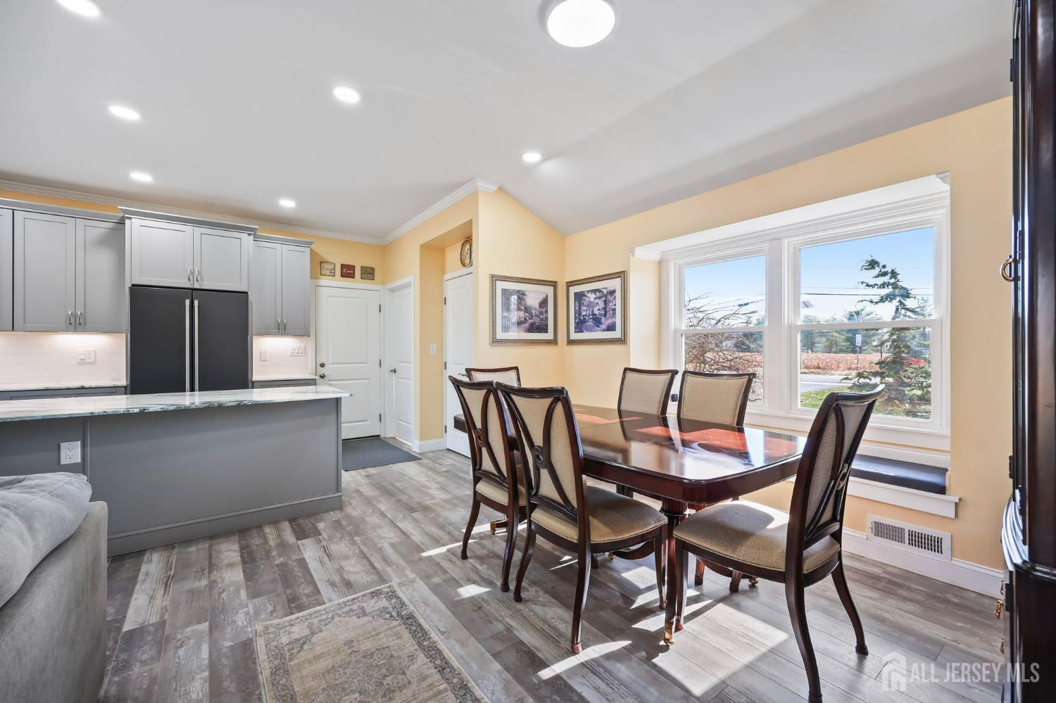 568 Village Road West Windsor, NJ 08550 - Photo 16 of 43 a view of a dining room with furniture and wooden floor