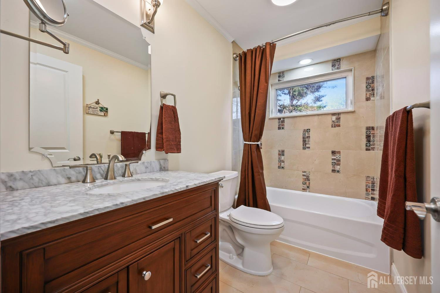 568 Village Road West Windsor, NJ 08550 - Photo 19 of 43 a bathroom with a granite countertop sink toilet and shower