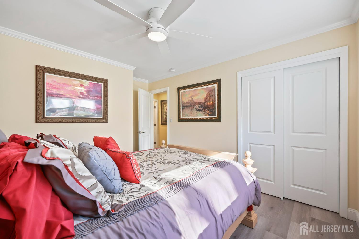 568 Village Road West Windsor, NJ 08550 - Photo 21 of 43 a bedroom with a bed and a painting on the wall