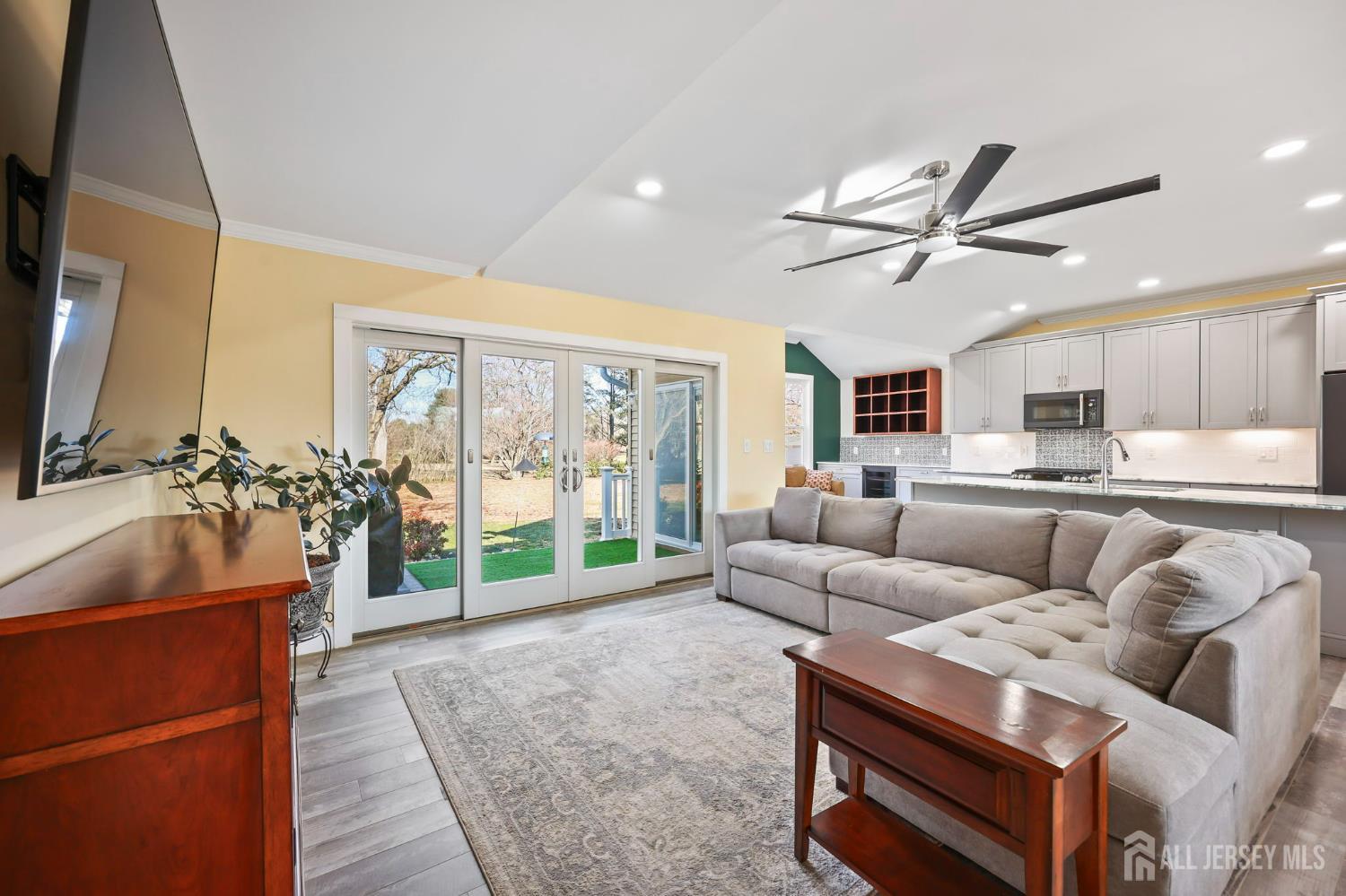 568 Village Road West Windsor, NJ 08550 - Photo 3 of 43 a living room with furniture and a flat screen tv