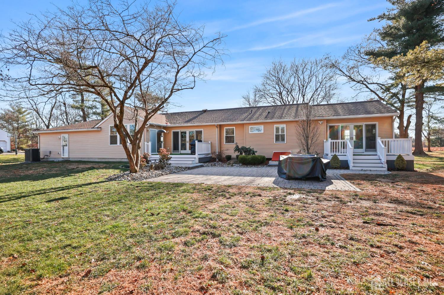 568 Village Road West Windsor, NJ 08550 - Photo 37 of 43 a view of a house with a yard covered in snow