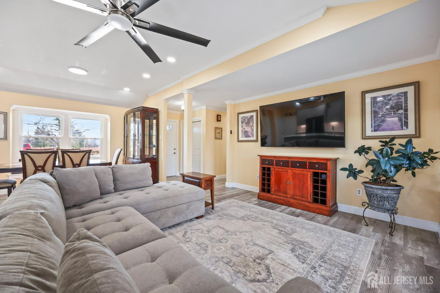 568 Village Road West Windsor, NJ 08550 - Photo 4 of 43 a living room with furniture and a flat screen tv