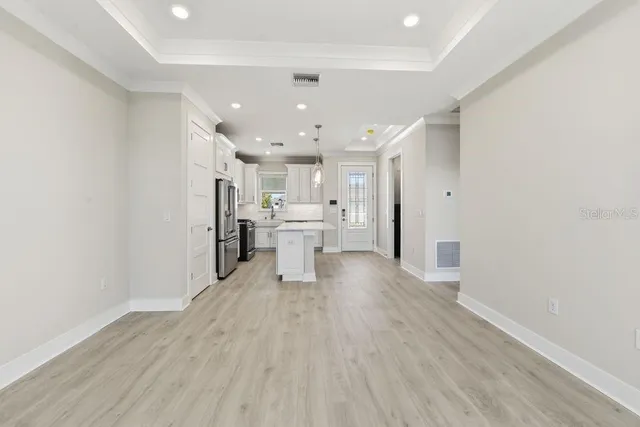 a view of a kitchen with a sink and cabinets