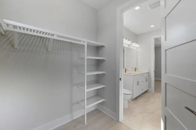 a view of an empty walk in closet