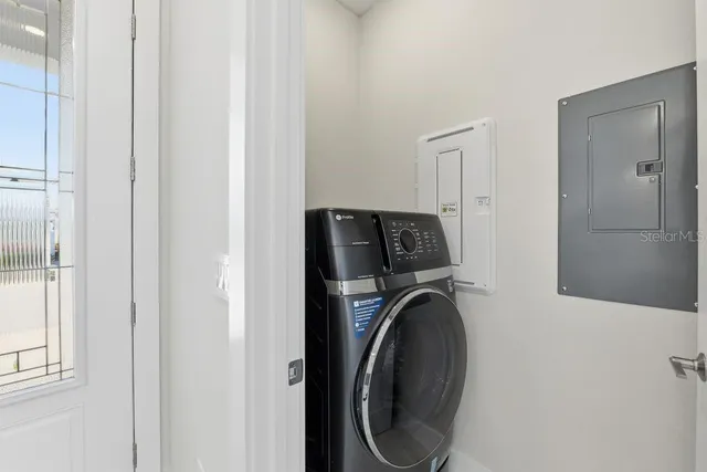 a view of storage and utility room with washer and dryer