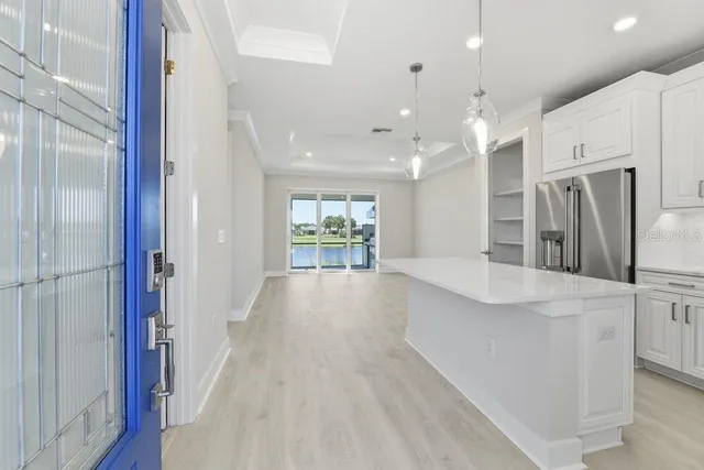 a view of kitchen with cabinets and stainless steel appliances