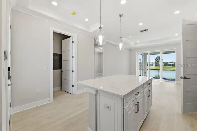 a kitchen that has a lot of cabinets in it