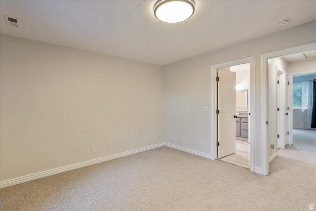 38 South 1000th Street East Payson, UT 84651 - Photo 18 of 19 Neutral wall paint with textured carpet flooring