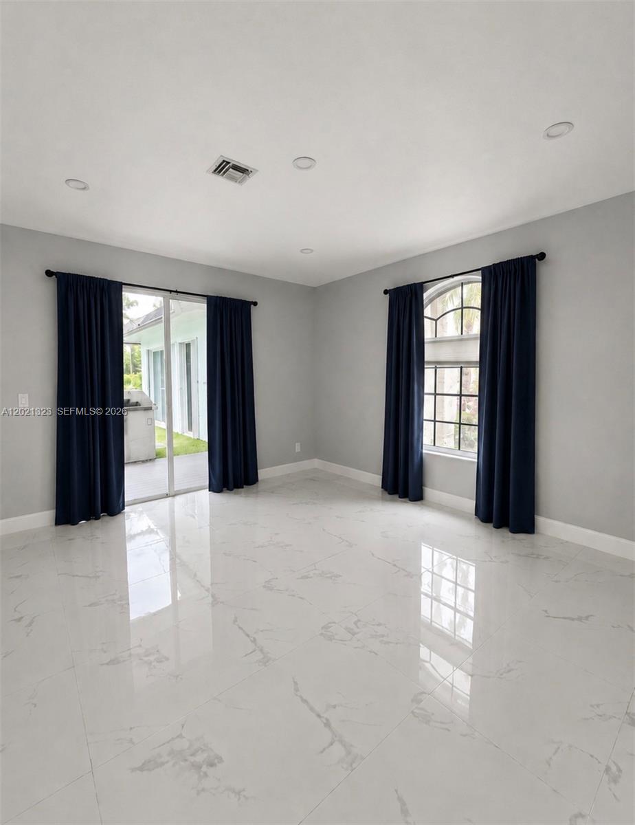 354 Mallard Road, Unit O Weston, FL 33327 - Photo 12 of 29 an empty room with windows and closet