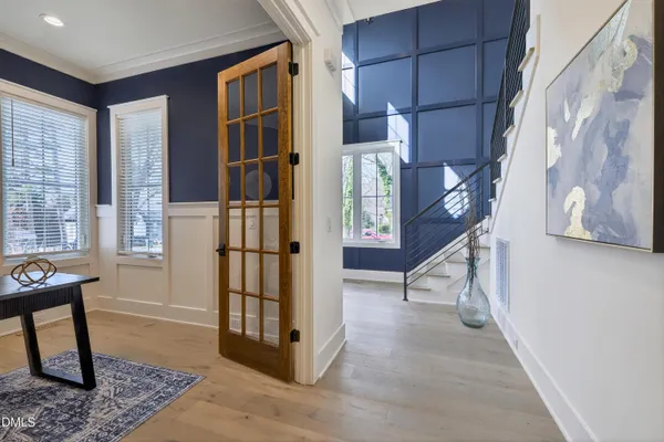 a bathroom with double vanity sinks and a mirror