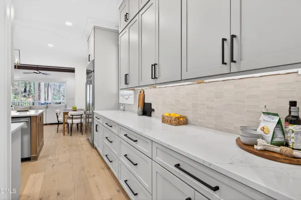 a bathroom with a sink vanity and toilet