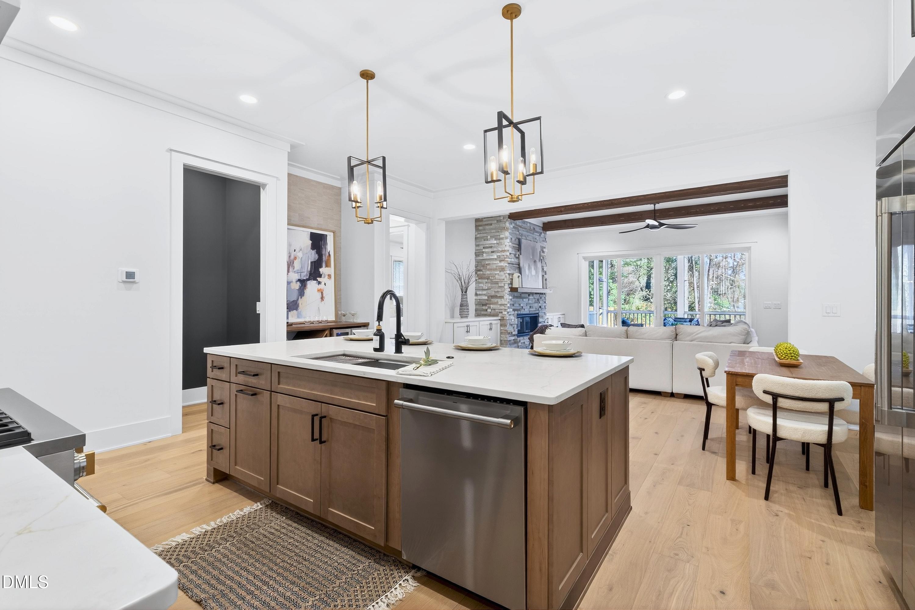 113 Boyd Street Cary, NC 27513 - Photo 14 of 88 a kitchen with a sink a counter space and wooden floor