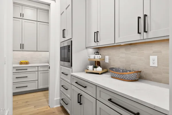 a bathroom with a double vanity sink mirror and shower