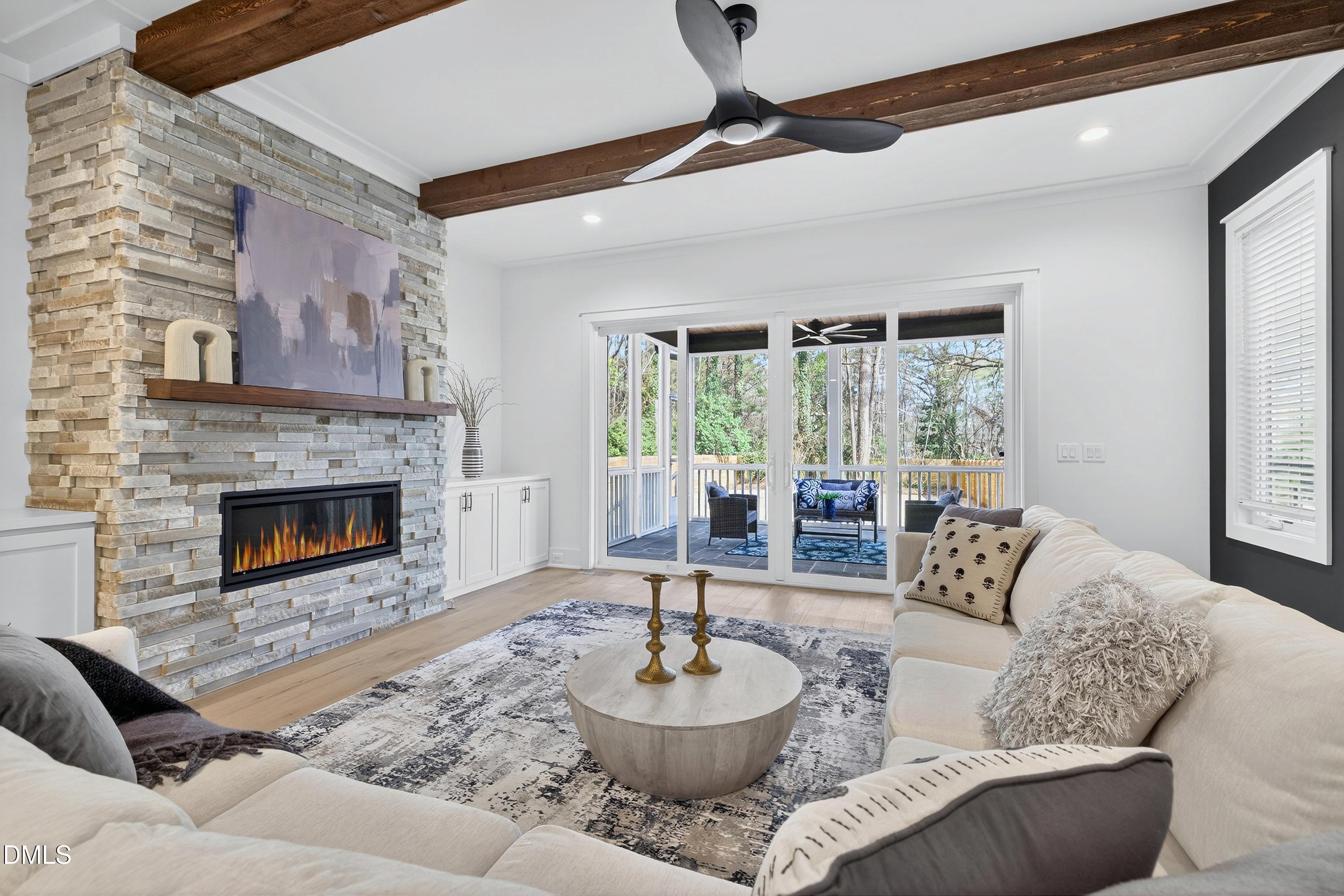 113 Boyd Street Cary, NC 27513 - Photo 29 of 88 a living room with furniture and a fireplace