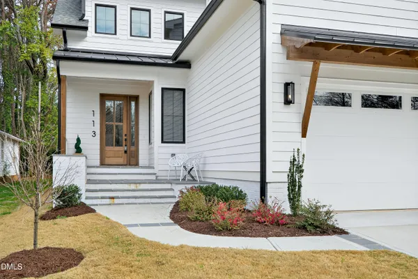 a kitchen with kitchen island granite countertop a sink stainless steel appliances and cabinets